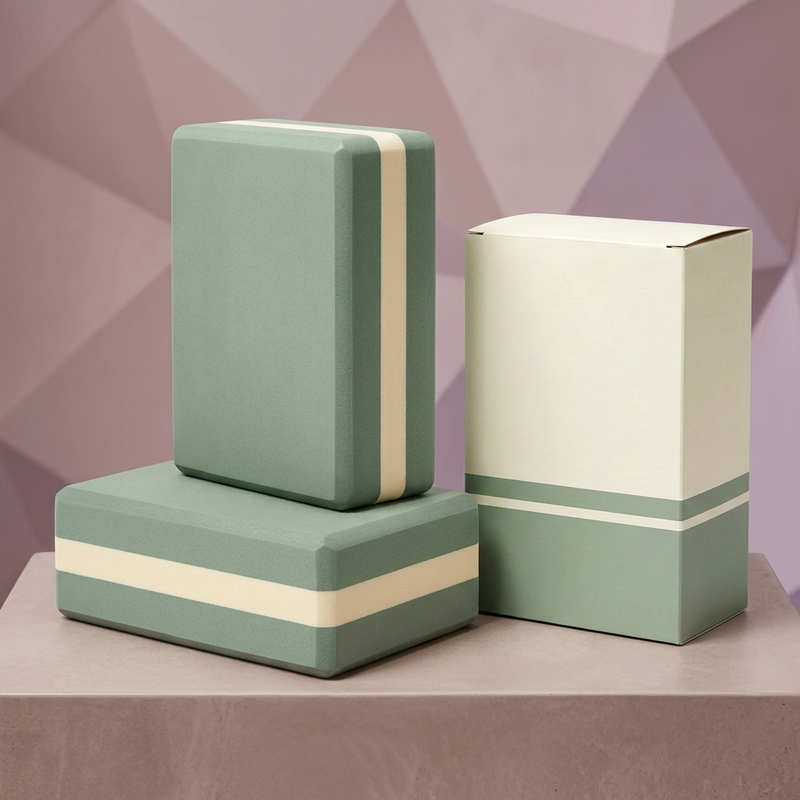 Sage and cream yoga block pair with blank matching carton on dusty rose podium
