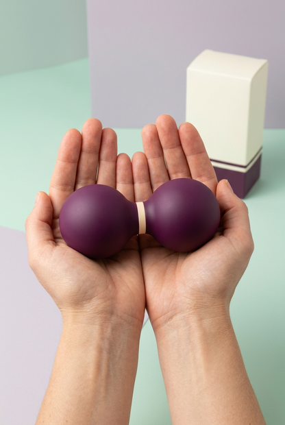 Deep Plum & Cream Peanut-Shaped Massage Ball — One Connected Double-Lobe Manual Massage Accessory with a Smooth Profile and Coordinated Logo-Free Carton
